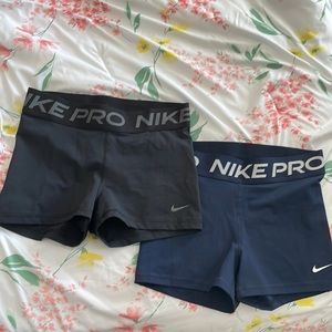 Black and blue nike pros, medium